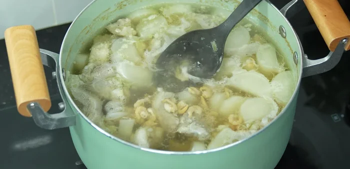 Simmer: Reduce heat to low and simmer until the bones are tender, adding water as needed.