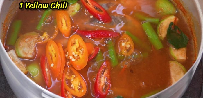Add red and yellow chilies.