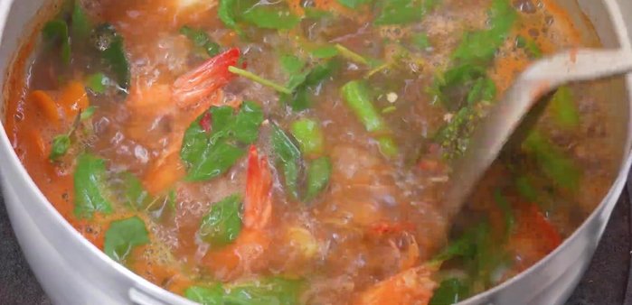 Once boiling again, add basil leaves.