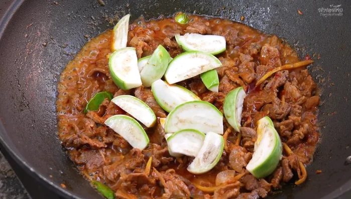 Add sliced eggplant and stir-fry briefly.