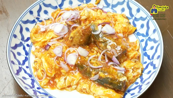 Garnish with sliced shallots, coriander, and a squeeze of lemon juice.