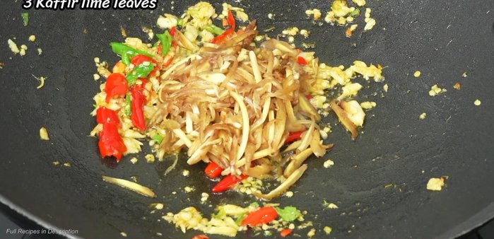 Add galangal and kaffir lime leaves, stir-fry until cooked.