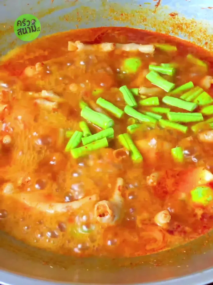 Add yardlong beans, galangal, bell peppers, chili peppers, and young peppercorns.