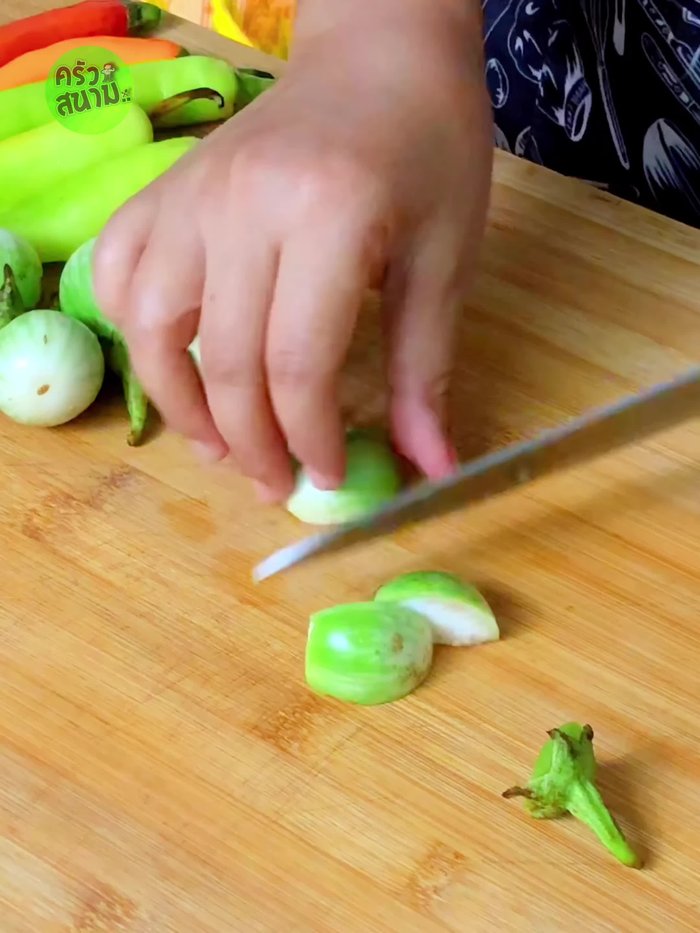 Cut the eggplant into pieces and soak in salt water to prevent browning.