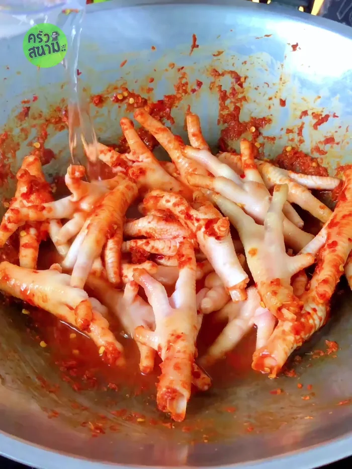 Pour in enough water to cover the chicken feet; bring to a boil.