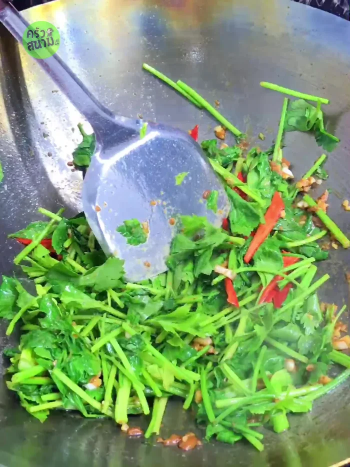 Season with 2 tbsp oyster sauce, 0.5 tbsp sugar, 0.5 tbsp seasoning sauce, and 3 tbsp water. Stir-fry until well mixed.