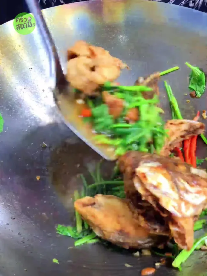 Add the crispy fried tilapia and stir-fry again. Turn off the heat and serve.