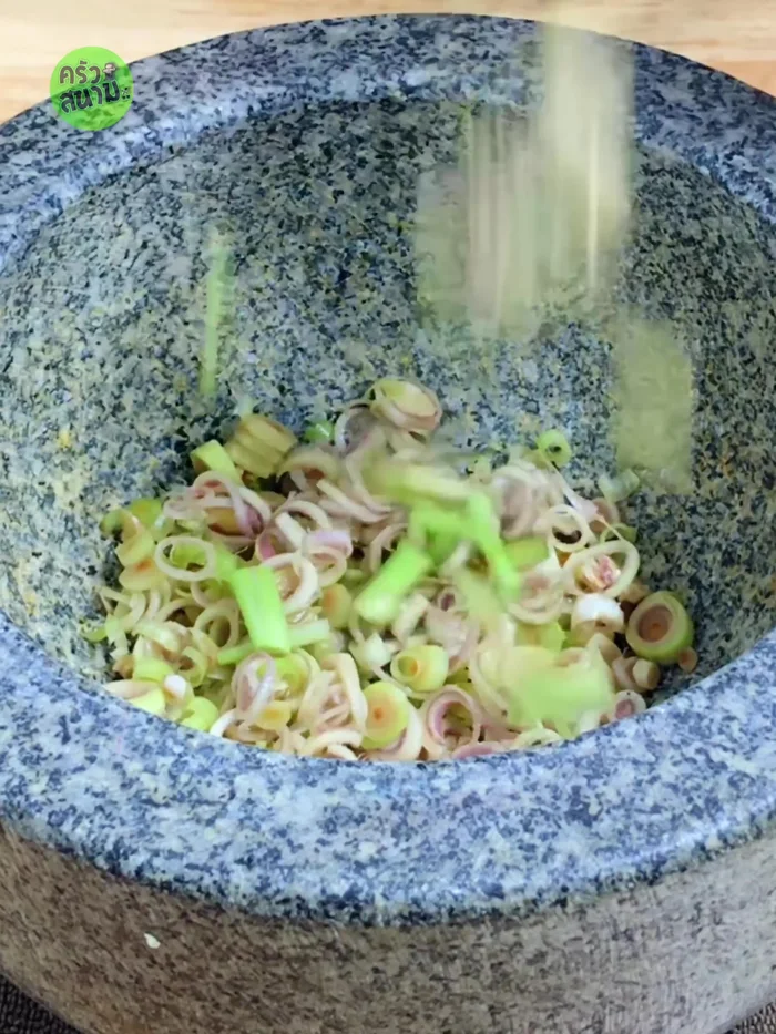 Pound 1 tbsp diced lemongrass, 3 stalks coriander root, 2 roots Chinese garlic, 10 cloves green & red chili, 25 small heads shallots, and 1 tsp salt.