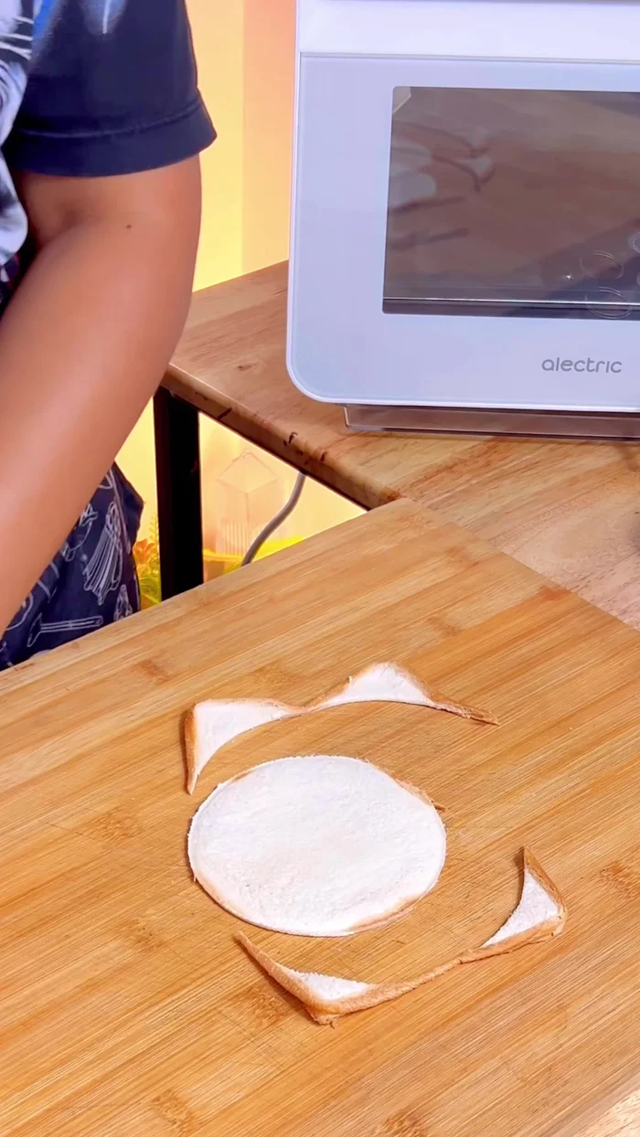 Press the bottom part of foil cups into the center of a cookie sheet.