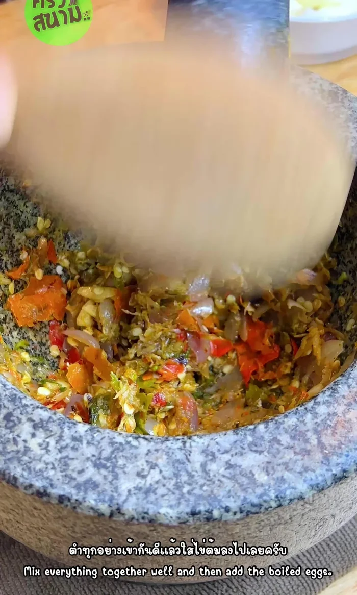 Add the chopped eggs to the pounded mixture. Bring to a boil.