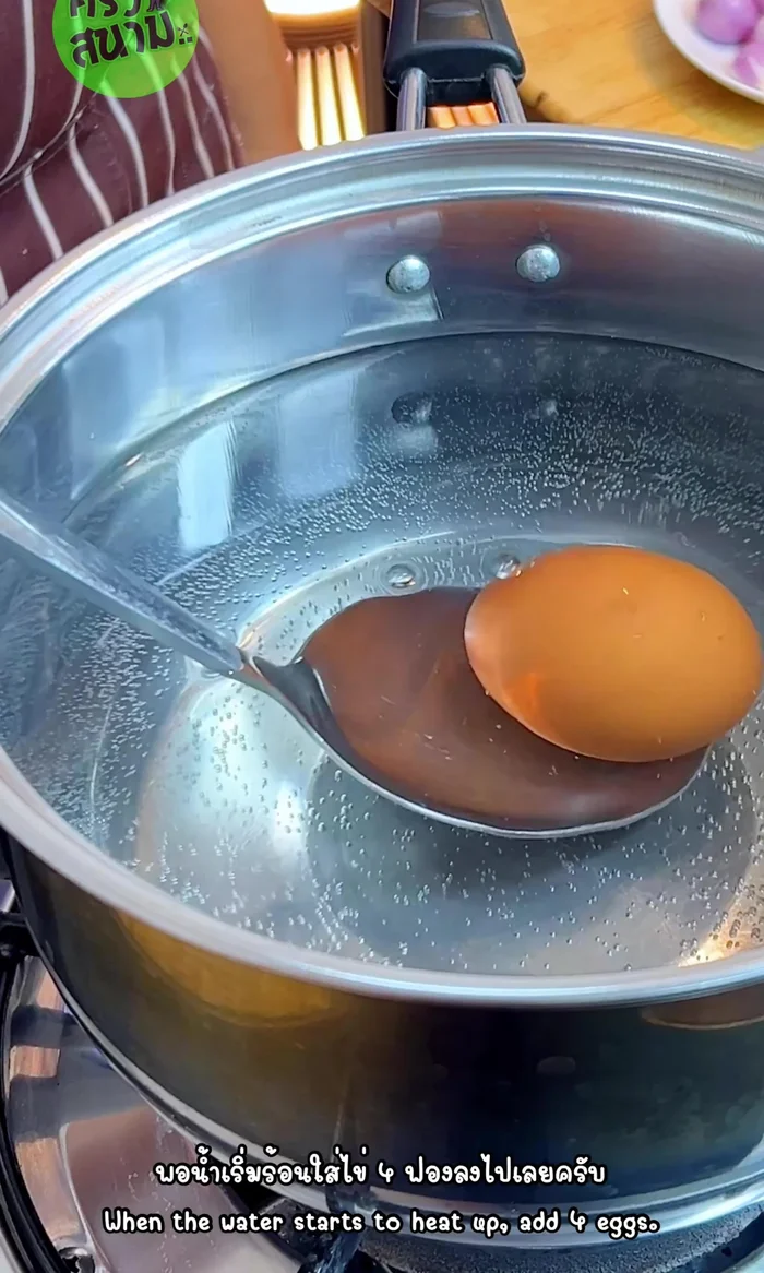 Add 4 eggs to the heated water. Use medium-low heat. Set timer for 8 minutes.
