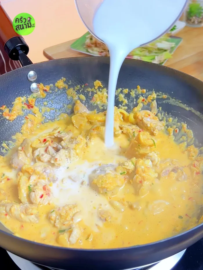 Add 500ml coconut milk, stir, and bring to a boil.