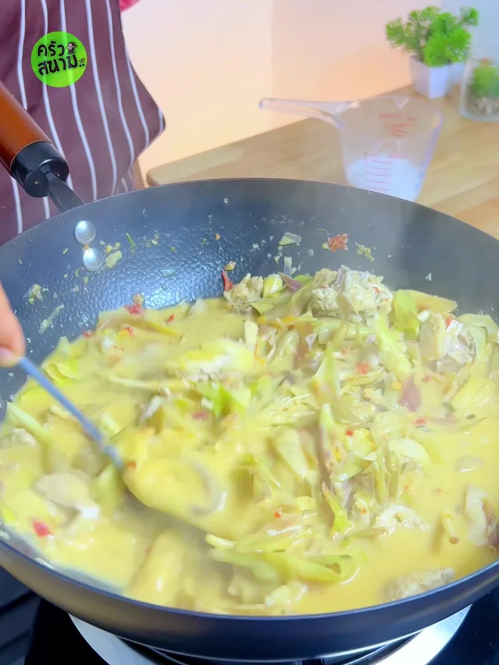 Add remaining coconut milk and torn kaffir lime leaves; simmer until fragrant.