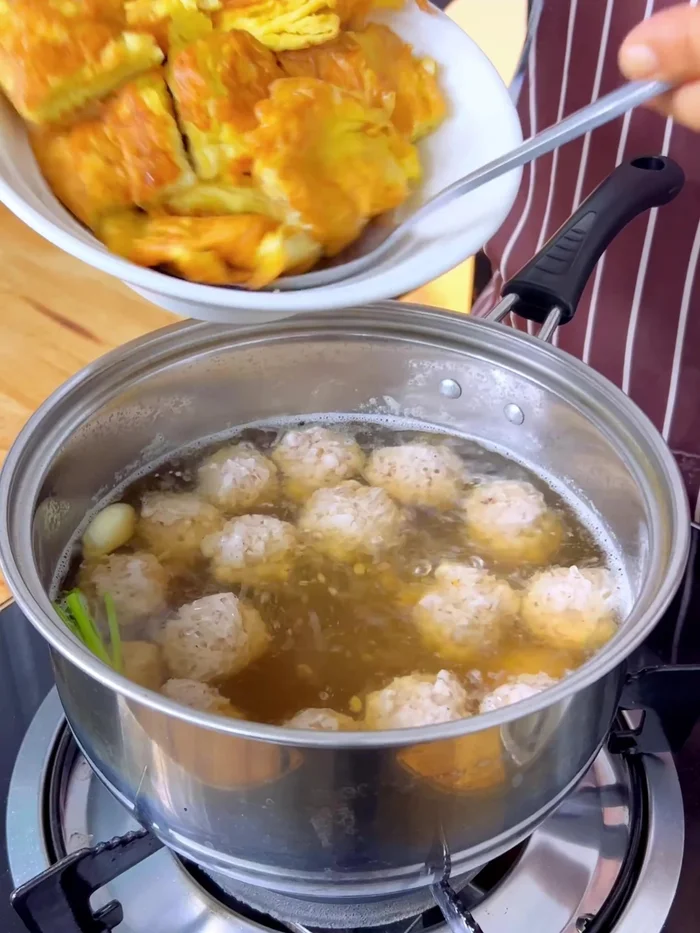Once pork is cooked, add egg tofu and fried eggs. Let it boil again.