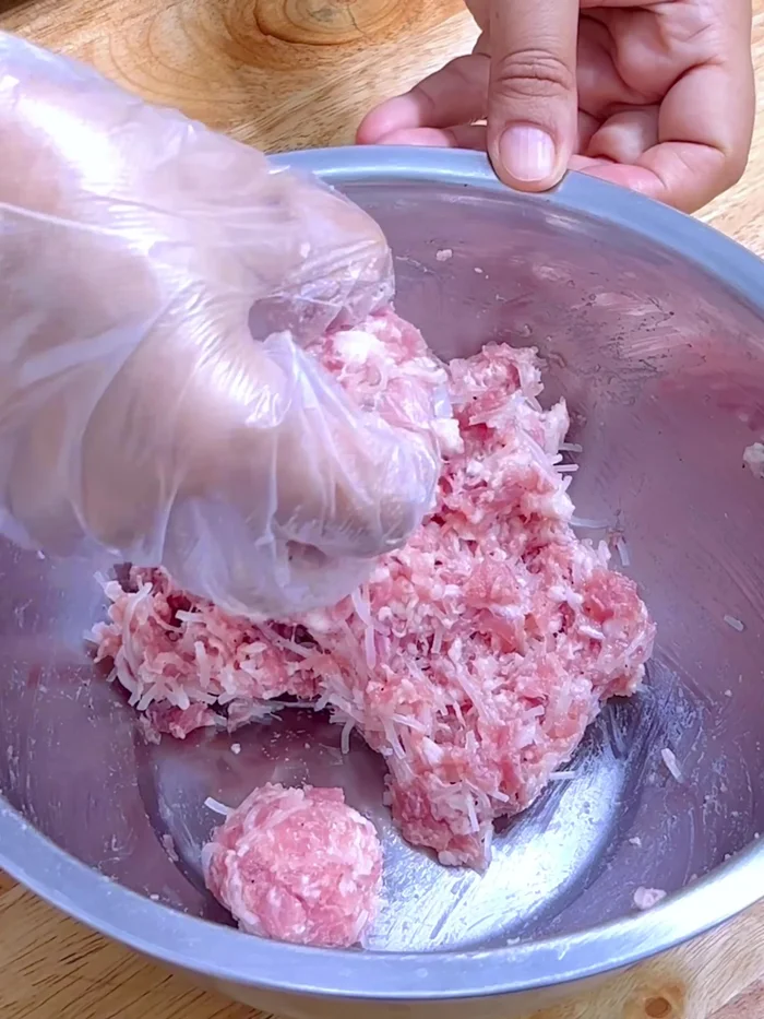 Shape the pork and noodle mixture into balls or bite-sized pieces. Set aside.