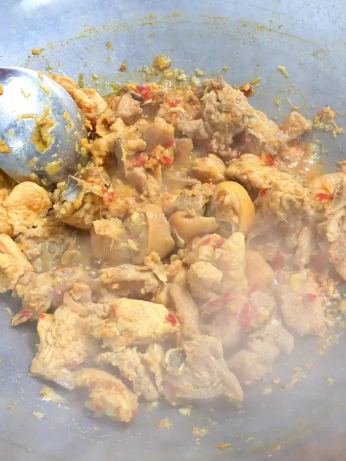 After 45 minutes, add chopped lemongrass, chopped galangal, and chilies. (112.079)