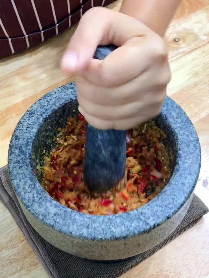 Combine all ingredients from steps 1-3 to create the curry paste. Pound well. (42.92)