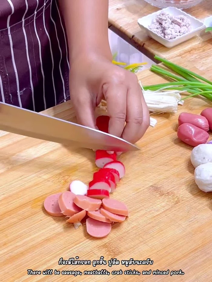 Prepare all ingredients: Cut crab sticks, mince pork, chop mushrooms, shallots, spring onions, and chili peppers. Prepare napa cabbage.