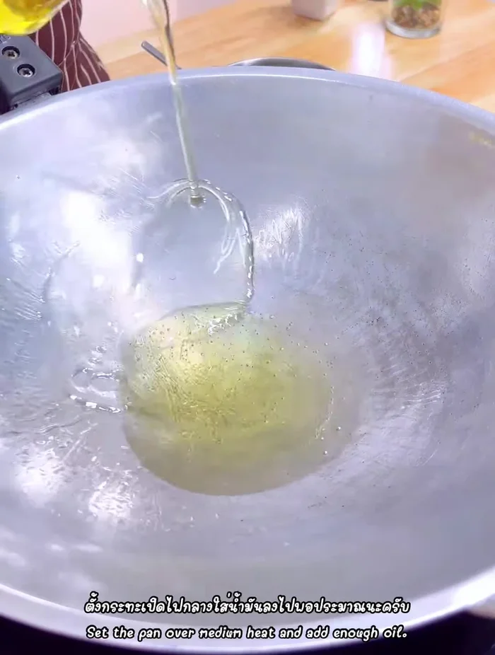 Heat oil in a frying pan over medium heat. Pour the egg mixture into the pan.