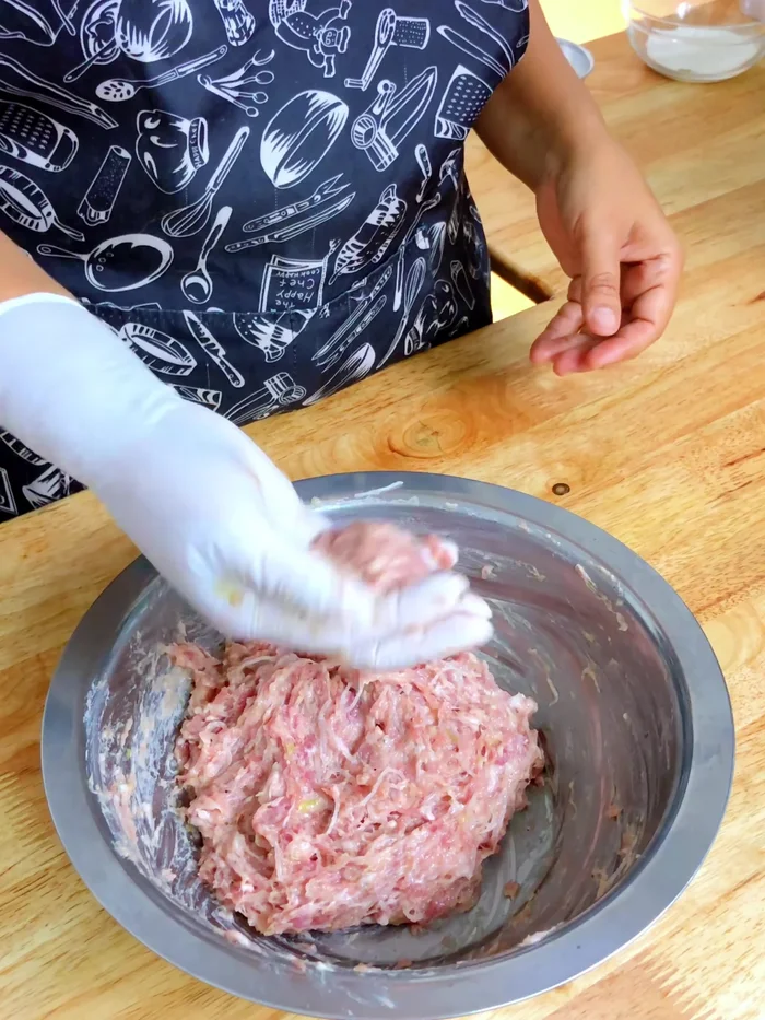 Shape the pork mixture into round balls.