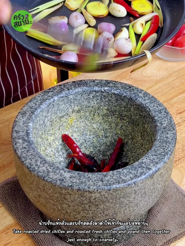 Pound the roasted chilies (dried and fresh) into a coarse paste.