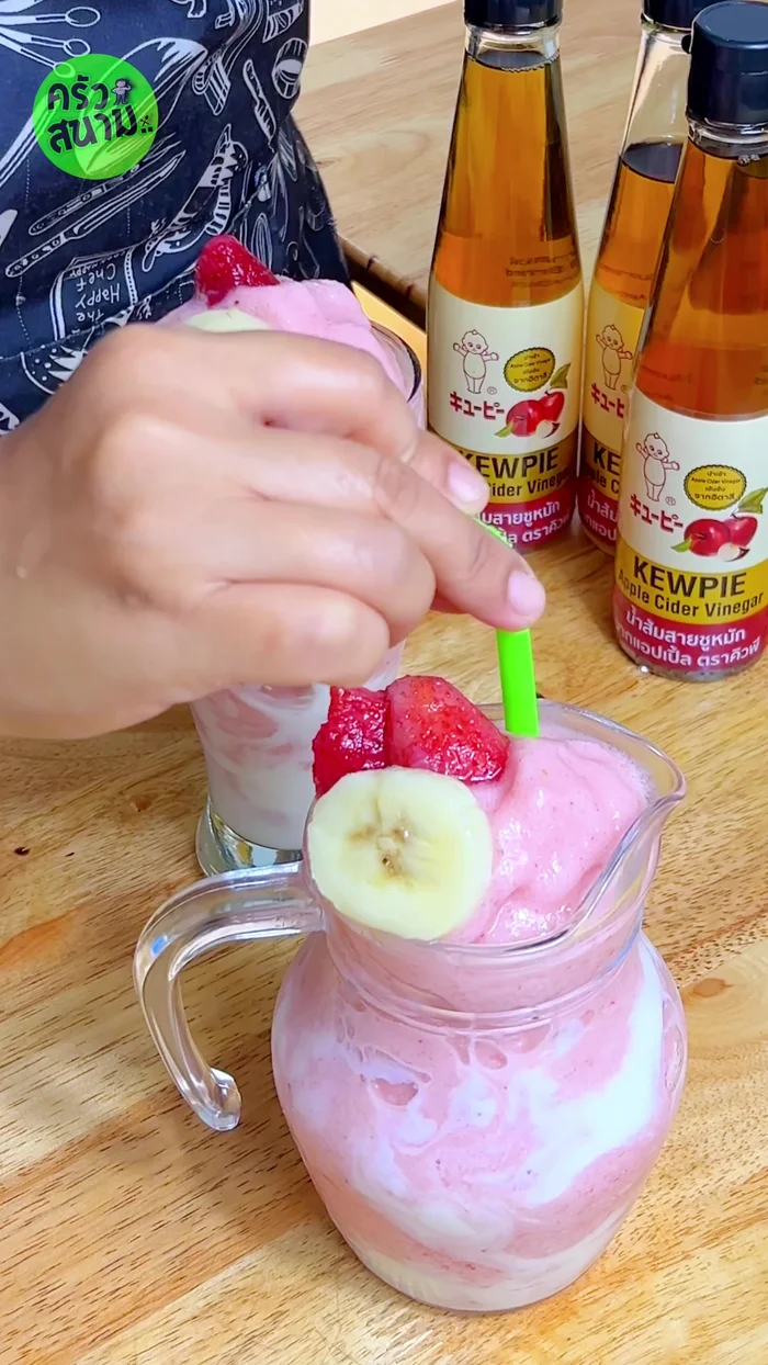 Top with fresh strawberries and banana slices.