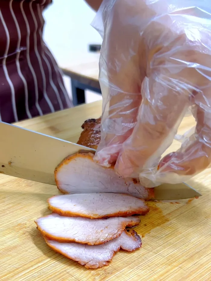 Serve: Slice the grilled red pork thinly and serve over rice with the red pork sauce and pickled chili soy sauce.