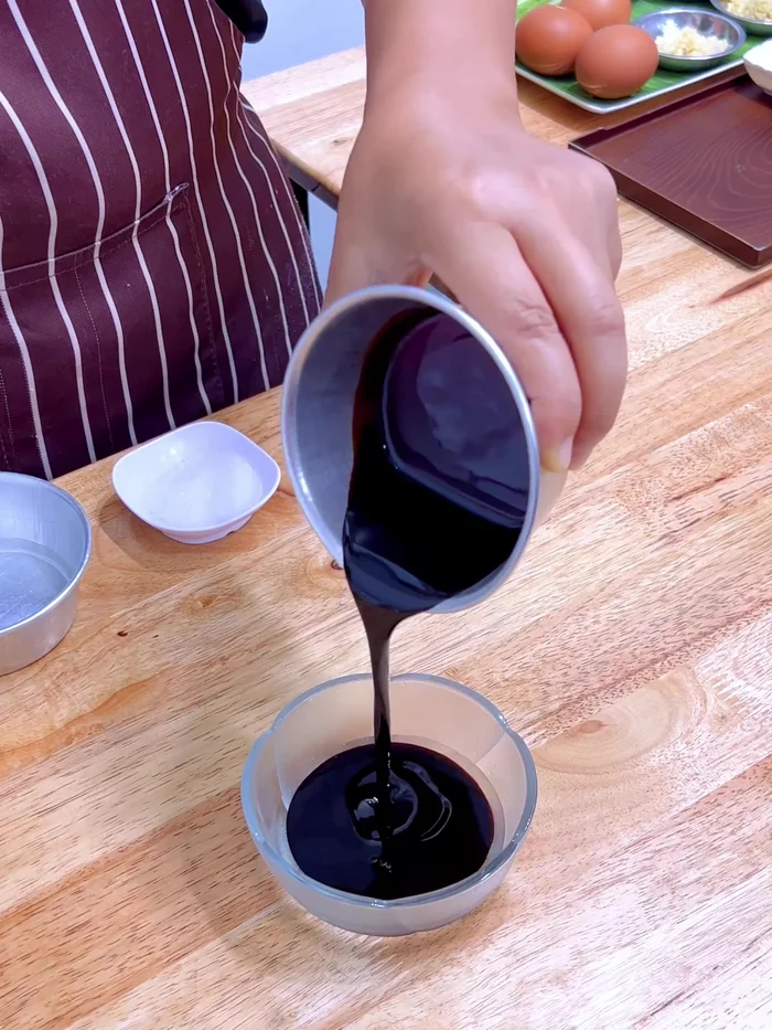 Make the pickled chili soy sauce: Mix soy sauce, black soy sauce, sugar, light soy sauce, water, and sliced red chili peppers.