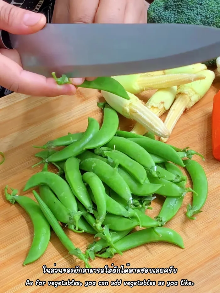 Prepare the vegetables: Remove stems and fibers from peas (16.68). Cut baby corn into pieces (39.04). Cut broccoli and cauliflower into florets (63, 71.759). Cut carrots into strips (83). Cut wood ear mushrooms into pieces (92.52). Cut tomatoes into pieces (111.719). Wash all vegetables except for wood ear mushrooms and tomatoes (117.24).
