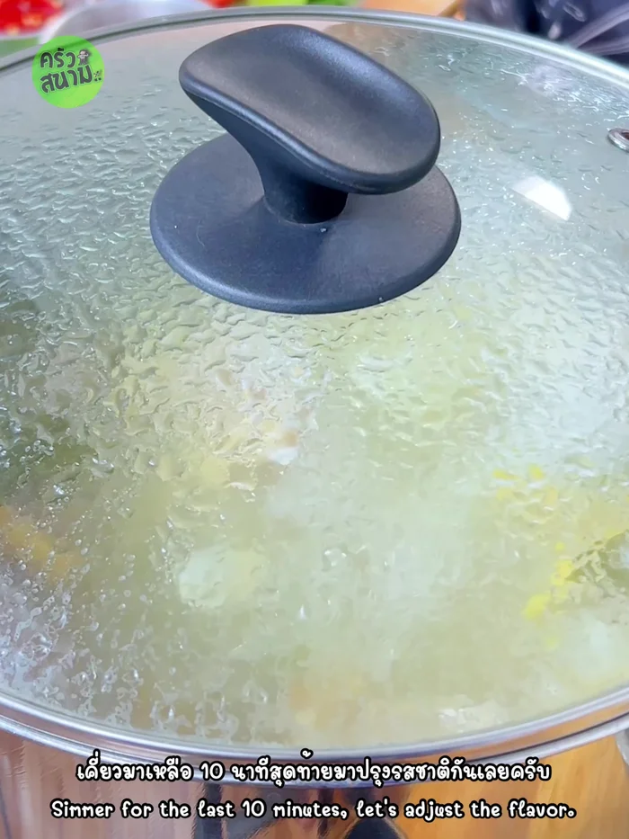 After 50 minutes of simmering, add fish sauce, tamarind juice, pounded chilies, and halved tomatoes.