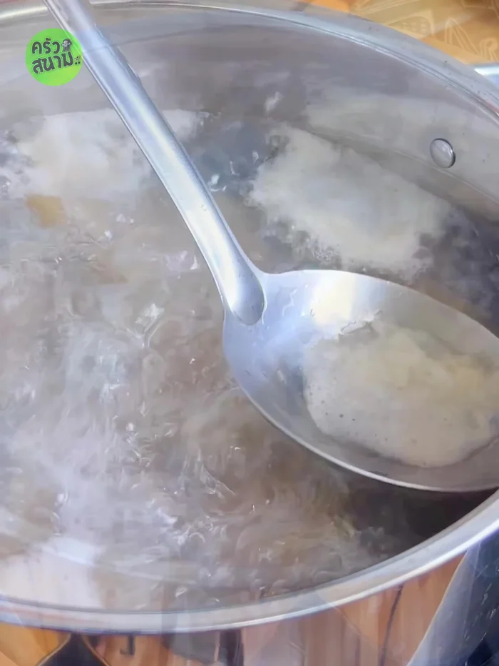 Once boiling, skim off any foam. Add 1 cup of ice to help the pork become tender.