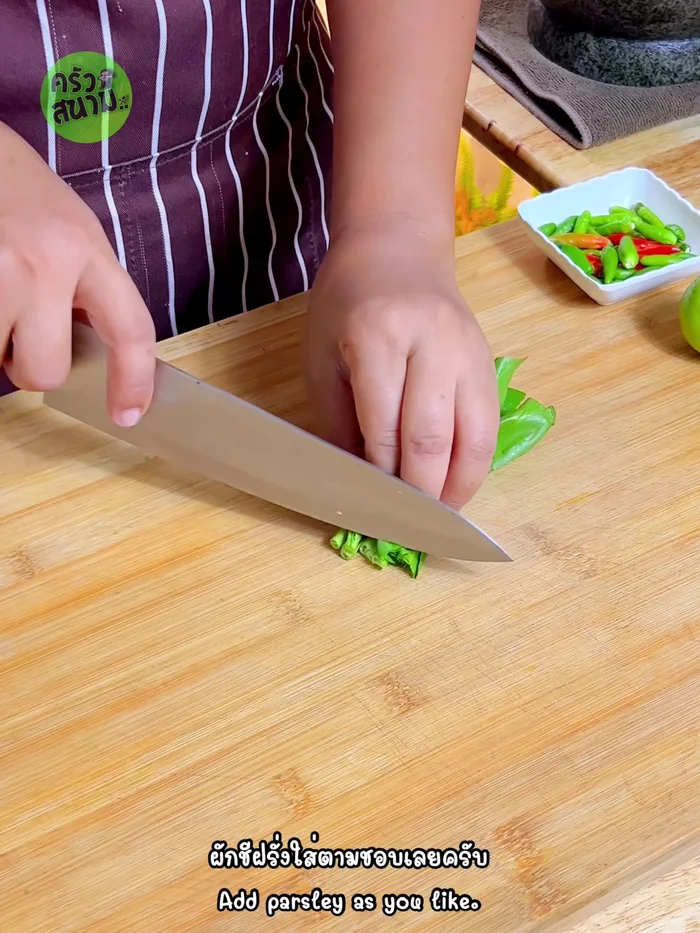Prepare the garnishes: Chop coriander, slice lime, and pound chili peppers to your desired level of spiciness.