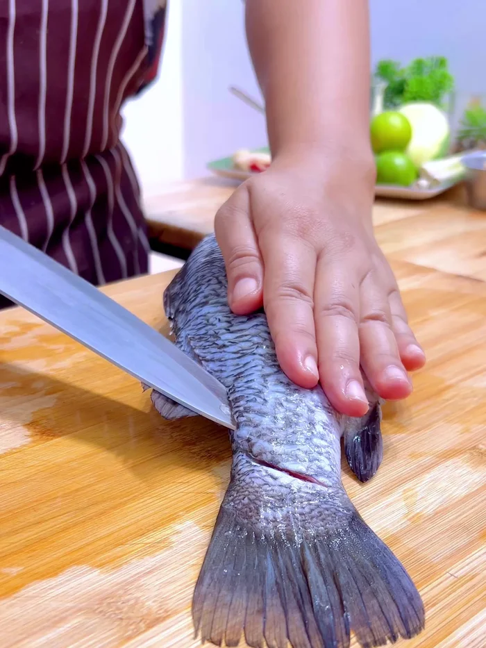 Cut the sea bass in half and fillet the fish. If you don't have sea bass, you can substitute tilapia, snakehead fish, or catfish.
