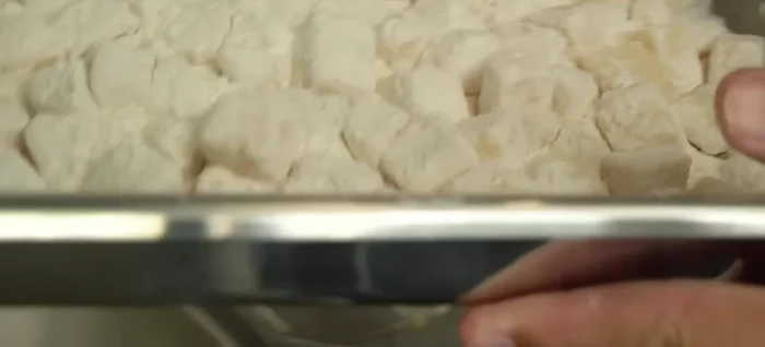 Heat the oil: Heat oil in a 38cm stainless steel pan over medium heat until hot enough. Test by sprinkling flour into the oil – it should sizzle and puff up.