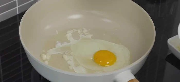 Add eggs and scramble, spreading them thinly across the pan. Cook until set, then remove from the pan.