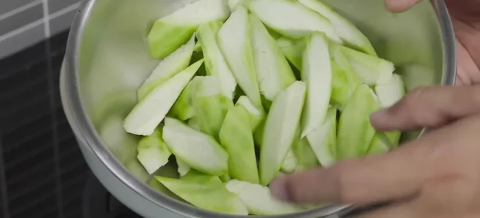 Prepare the zucchini: Clean, peel, and cut into desired sizes.