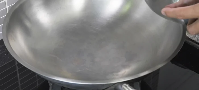 Heat the oil in a large frying pan over medium heat until very hot.