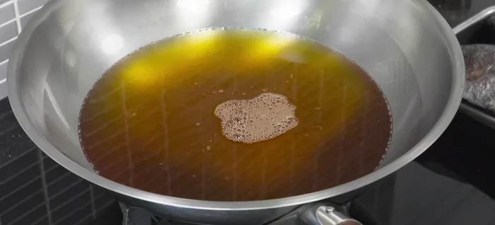 Carefully add the fish to the hot oil, ensuring not to overcrowd the pan. Avoid splashing. Fry until golden brown and crispy, turning once, about 5-7 minutes per side. Remove and drain on paper towels.