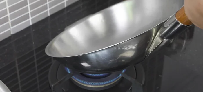 In a separate pan, heat a small amount of oil and stir-fry the blended chili mixture until fragrant.