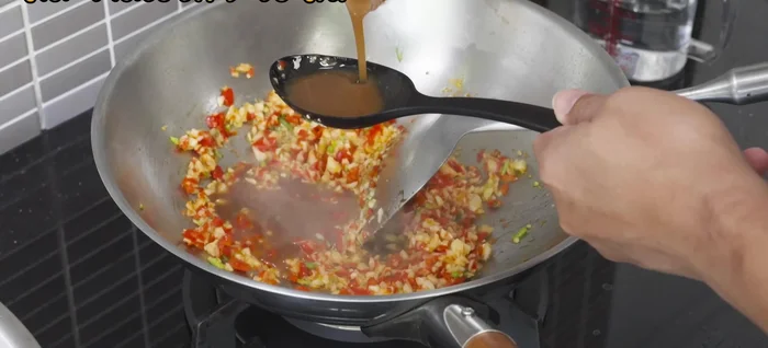 Add tamarind juice, palm sugar, fish sauce, and water to the chili mixture. Simmer until the sugar dissolves, flavors meld, and the sauce thickens to your desired consistency. Add tapioca flour mixed with water if needed to thicken.