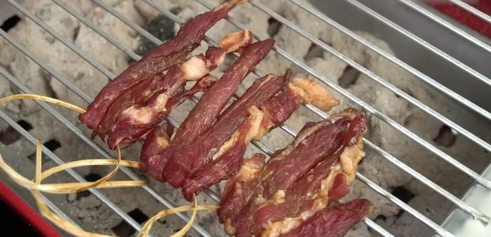 Grill the pork skewers: Grill the skewers over low heat until cooked through and slightly browned, flipping occasionally. Once cooked, dip in the fermented fish sauce and grill again briefly.