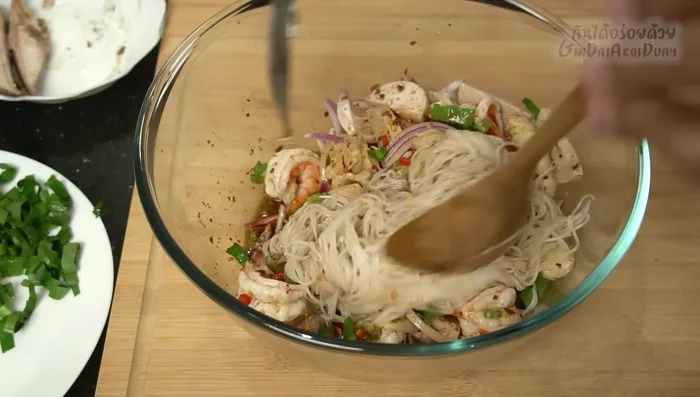 Pour the dressing over the ingredients and mix well.