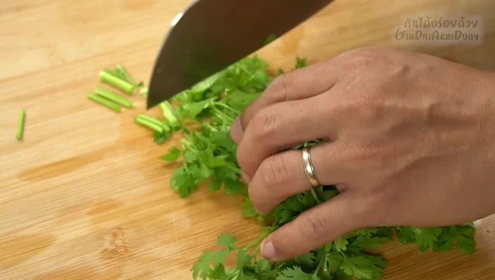 Prepare the herbs: Chop coriander and parsley.
