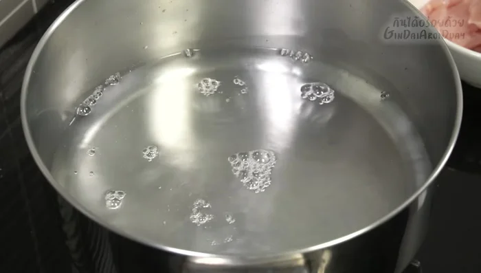 Boil the chicken: Boil water in a pot. Add chicken and simmer until cooked. Avoid using too much water.