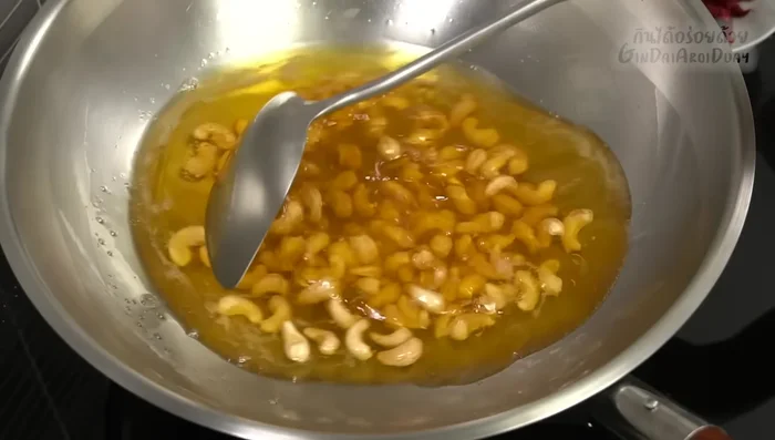 Fry the cashew nuts until golden brown.