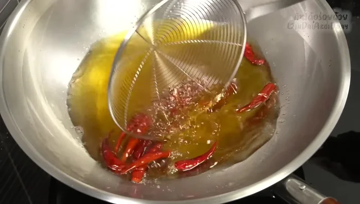 Lightly fry the dried chilies until fragrant.