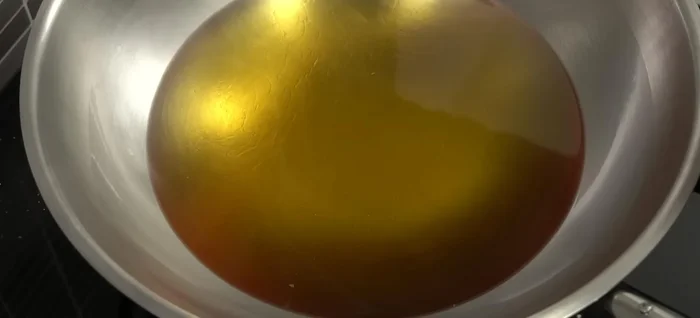 Heat oil in a frying pan over medium heat. Once hot, carefully drop spoonfuls of the mixture into the hot oil.