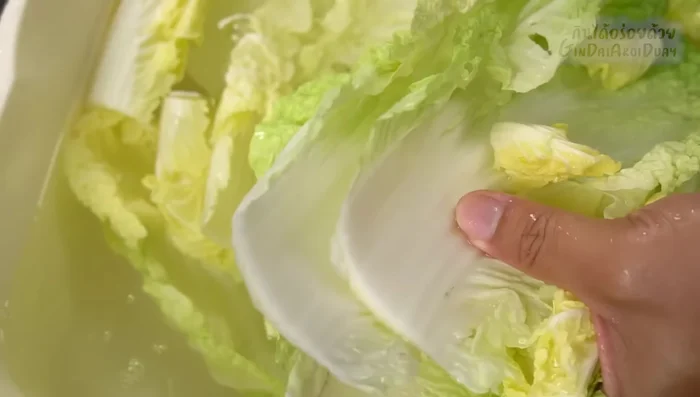 Blanch the white cabbage leaves in boiling water until softened, but not overcooked.