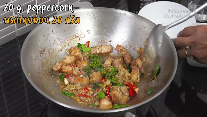 Add young peppercorns and stir-fry briefly.