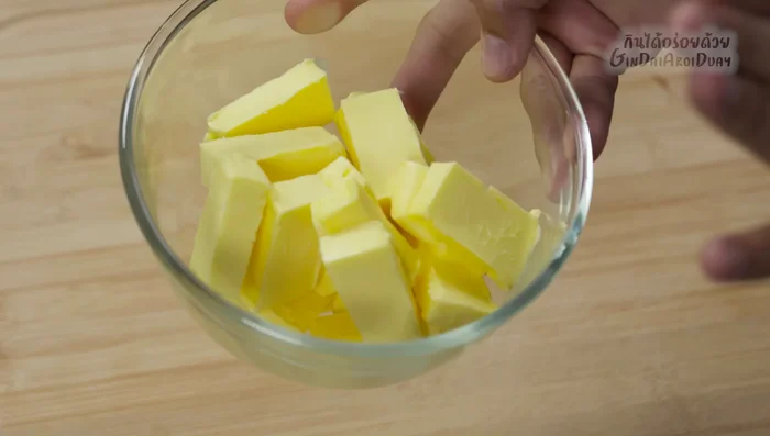 Once the bread is cool, beat the butter until fluffy.